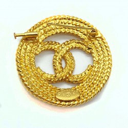 Broche Chanel doré double CC